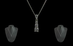 Ladies 9ct White Gold Pleasing 3 Stone Diamond Set Drop with 9ct White Gold Chain. Both Marked 9ct.