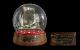 A Silver Model of a Yacht housed in glass dome set with pearls.