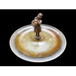 Bronze Shallow Dish with central figure of a peasant girl with a duck. Diameter 9'', approx.