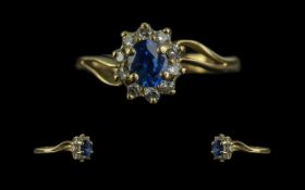 Ladies 18ct Gold - Good Quality Petite Tanzanite and Diamond Set Cluster Ring. Marked 18ct to Shank.