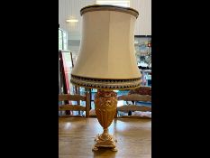 Large Gilt Table Lamp, with ornate rams head decoration. Raised on four feet. Measures approx.