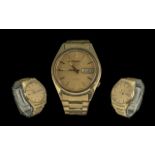 Seiko 5 Automatic Gents Gold on Steel Wrist Watch, Diameter 34 mm, Features Champagne Dial,