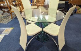 Round Glass Top Dining Table with four chairs. Table raised on green glass spiral pedestal, diameter