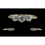 Edwardian Period 1902 - 1910 18ct and Platinum 3 Stone Diamond Set Ring. Marked 18ct and Platinum to