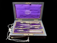 Mahogany Box Containing Drawing Instruments, by A W Gamage Ltd., of Holborn, London. Purple lined