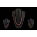 A Fine Early 20th Century Graduated Cherry Amber Beaded Necklace. 26'' length - 65.0 cm. Weight 63.5