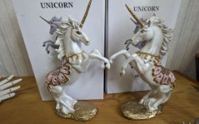 Two Unicorn Horse Figures with pink and mirrored decoration, in boxes, measure 13'' tall.