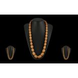 Superb Quality 1920's Graduated Natural Butterscotch Amber Beaded Necklace, of long length. All