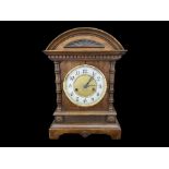 An Edwardian Wooden Mantle Clock, white enamel chapter dial with Arabic numerals. Height 14''.