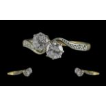 18ct Gold Attractive 2 Stone Diamond Set Twist Ring. Marked 18ct to Interior of Shank. The Two Round