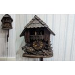Wooden Carved Cuckoo Clock, with carvings of horses pulling logs, brass Roman numerals, pendulums,