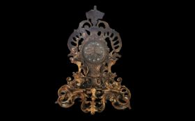Early 20th Century Ormolu Clock, decorative dragon head and floral pattern. Gold embellished face,