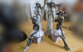 Two Ceramic Standing Angel Figures, measure 11'' tall, together with two seated ballerina figures,