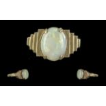 18ct Gold Attractive Single Stone Opal Set Ring. Marked 18ct to Interior of Shank. The Oval Shaped