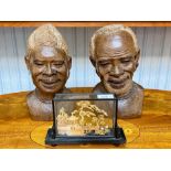 Two Carved Wooden Tribal Art Heads from Zimbabwe, 12'' high, depicting a lady and man, finely