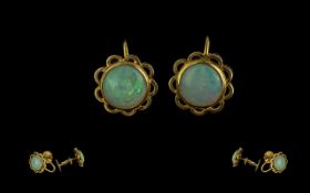 18ct Gold - Attractive Pair of Opal Set Earrings. Marked 18ct. The Round Opals of Excellent
