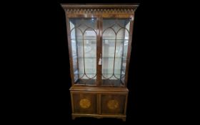 Tall Display Cabinet, glass front with fretwork, carved column design to top of cabinet, above two