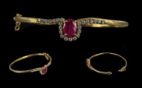 A Fine Quality - Attractive 9ct Gold Ruby and Diamond Set Hinged Bangle. Marked 9ct. The Large