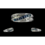 14ct White Gold Contemporary Designed Sapphire & Diamond Set Dress Ring. Marked 14ct to shank. The