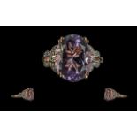 Amethyst Designer Style Ring. an oval cu