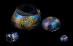 John Ditchfield Glasform Two Opalescent paperweights one in the form of a pebble surmounted by a