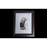 Signed Photograph of Kylie Minogue, mounted, framed and glazed,