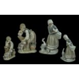 A Pair of Lladro Handpainted Porcelain Figures, comprising 1. Caress & Posy Model No.