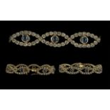 Ladies 14ct Gold Attractive Diamond and Sapphire Set Figure-of-Eight Design Bracelet, marked 14ct,