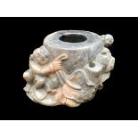 An Oriental 19thC Hardstone Carved Inkwell depicting figures in foliage,