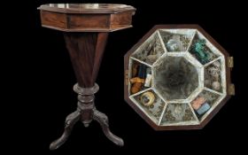 A Victorian Sewing Table with an octagonal top and lift up lid revealing a compartmental tray with