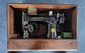 Vintage Singer Sewing Machine, black and gold, in fitted case. Serial No. EN 861805.