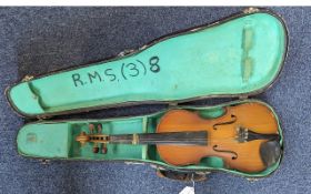 A Child's Violin in a Fitted Case. Length approx. 20". As found condition.