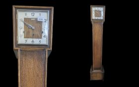 Kendall & Dent of London Granddaughter Clock, square column base with square face.