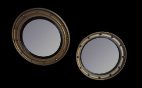 Two Port Hole Gilt Mirrors with convex glass. Measuring 18 and 20 inches in diameter.
