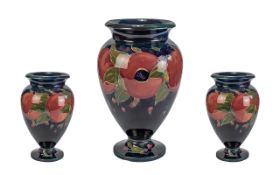 William Moorcroft Signed Goblet Vase, 'Pomegranate and Leaves' design on blue ground,