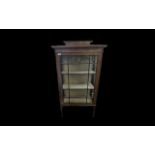 An Edwardian Mahogany Display Cabinet Astral glazed front raised on square tapered legs,