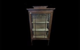 An Edwardian Mahogany Display Cabinet Astral glazed front raised on square tapered legs, with string