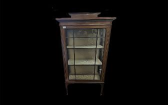 An Edwardian Mahogany Display Cabinet Astral glazed front raised on square tapered legs,