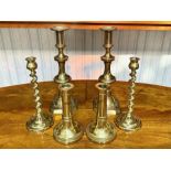 Six Brass Candlesticks, comprising a pair of 12" candlesticks, a pair of twisted 9" sticks,