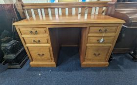A Unicorn Man Oak Desk, the moulded rectangular top over three graduated drawers each side,