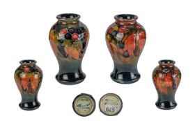 William Moorcroft Signed Pair of Small Flambe Baluster Vases, 'Flambe Leaf and Berries' design,
