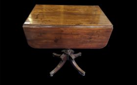 A Victorian Mahogany Pembroke Table of small proportions with drop leaves. Single drawer, raised