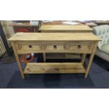 A Pine Occasional/Hallway Table Three Drawers with storage space underneath.