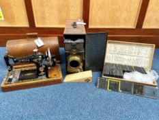 Magic Lantern with a wooden box containing approx. 100 glass slides with religious themes.