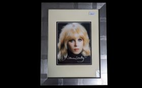 Signed Photograph of Joanna Lumley, in the Avengers period, mounted, framed and glazed, with