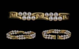 A Superb Quality Ladies Signed 18ct And Cultured Pearl Set Bracelet Of Cotemporary Design. Marked