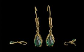 Ladies Pair of 14ct Gold Attractive Emerald Set Drop Earrings marked 14ct.