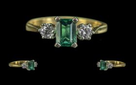 18ct Gold - Attractive 3 Stone Emerald and Diamond Set Ring. Marked 750 - 18ct. The Central