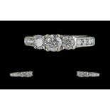 18ct White Gold Contemporary Design Three Stone Diamond Set Ring with diamond shoulders,