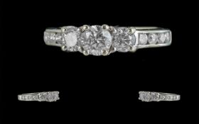 18ct White Gold Contemporary Design Three Stone Diamond Set Ring with diamond shoulders,